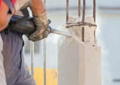 Core drilling in concrete for construction and testing purposes.