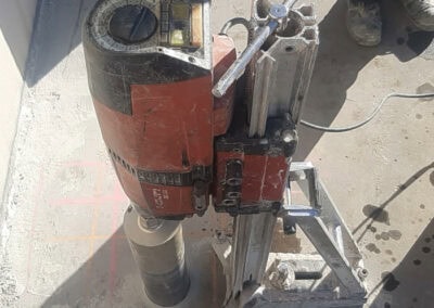 Heavy-duty core drilling machine used for precise rock and concrete drilling.