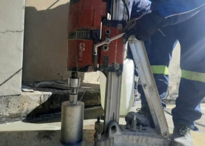 Core drilling machine in use for construction.