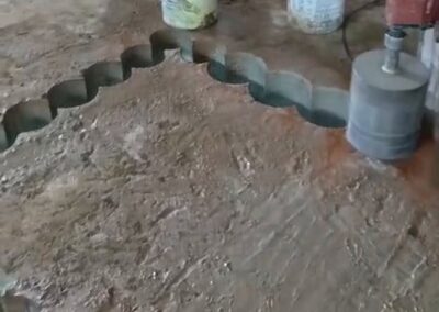 Curved stitch core drilling pattern cut into a concrete slab to form a stairway opening at Diplomat Hotel, Johannesburg CBD