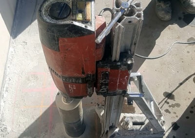 Heavy-duty core drilling machine used for precise rock and concrete drilling.